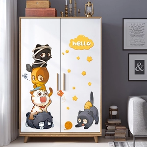 Detail of cute cartoon cat stickers on a white closet for nursery wall decoration