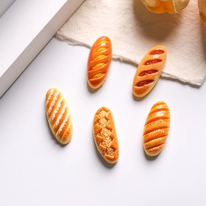 Miniature resin bread charms including croissants and baguettes for DIY crafts