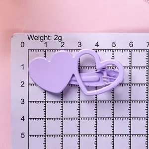 Pince à cheveux coeur violette avec double motif superposé, taille environ 5,5x3 cm