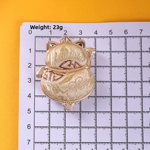 Golden Chinese Lucky Cat pendant with embossed texture on ruler background 4.5cm