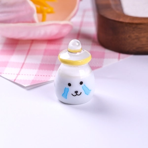 Close-up of a cute miniature resin yogurt bottle with a crying face for dollhouse DIY