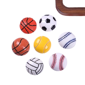 Miniature resin sports balls set featuring football basketball and baseball on white