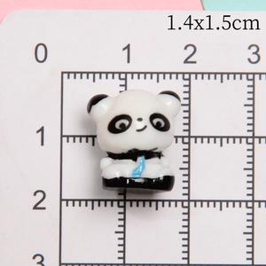 Macro scale shot showing 1.4x1.5cm dimensions of the 3D resin panda miniature charm