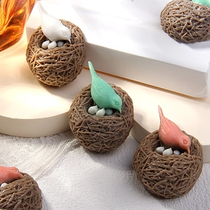 Macro shot of forest bird nest resin charms with eggs for DIY jewelry and crafts