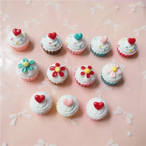 Detailed macro view of twelve resin artificial cupcakes for DIY phone case crafts