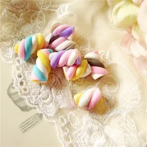 Macro detail of twisted marshmallow resin charms for DIY crafts and phone case decor