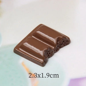 Macro detail of realistic 3D resin chocolate charm with bite mark for DIY crafts 2.3x1.9cm