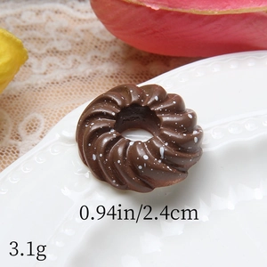 Detailed macro view of chocolate resin donut charm showing size 0.94 inch and 3.1g weight