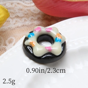 Detailed close-up of a chocolate resin donut charm with dimensions and cream topping