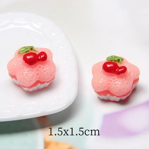 Detailed macro view of 1.5x1.5cm miniature resin strawberry cherry cake for DIY crafts