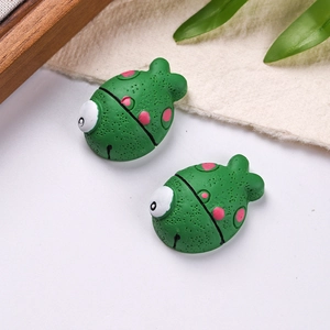 Detail of green and pink resin clownfish DIY charms for clogs and accessories