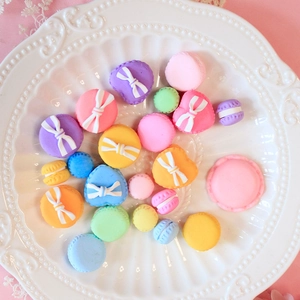 Assorted macaroon resin charms with heart shapes and bows for DIY phone case crafts