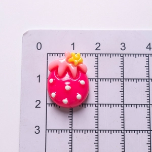 Pink resin strawberry charm with white dots and yellow flower for DIY hair accessories