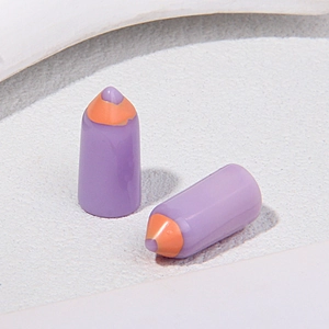 Macro shot of two lavender mini pencils on a textured stone base for DIY crafts