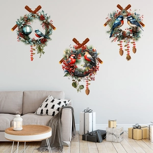 Winter pine branch wall stickers with birds and berries over a gray sofa