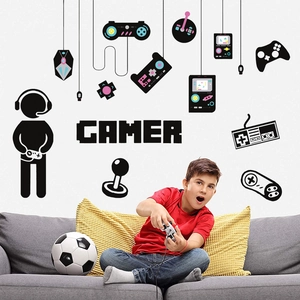 Detailed view of gamer wall stickers featuring gaming controllers and pixels in a bedroom