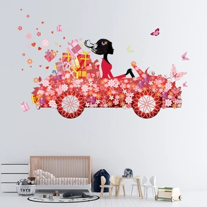 Detail of red floral car wall sticker with butterflies in a cozy kid's bedroom setting