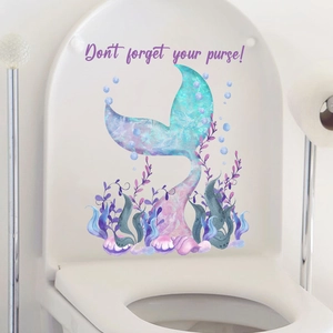 Detailed watercolor mermaid tail wall sticker on a white toilet lid with bubbles and shells