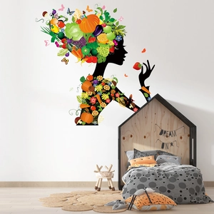 Creative fruit and vegetable girl silhouette wall decal in a cozy bedroom setting