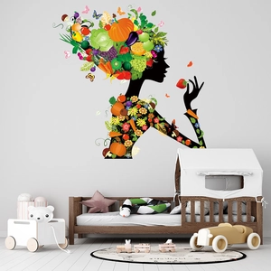 Creative wall sticker with girl silhouette made of colorful fruits, vegetables and flowers