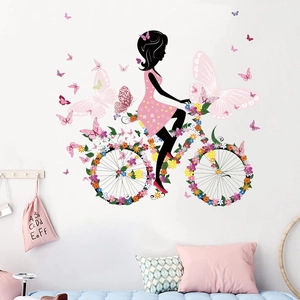 Wandsticker Blumenfee auf Fahrrad mit Schmetterlingen für ein gemütliches Kinderzimmer