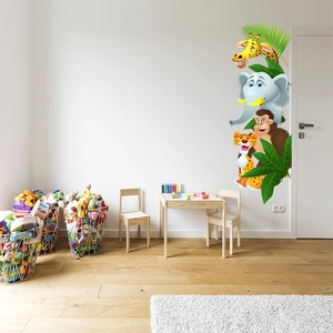 Jungle wall stickers with giraffe and elephant in a minimalist children's room interior