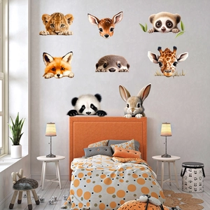 Detailed view of cute cartoon animal wall stickers featuring lion and giraffe in a kids' room