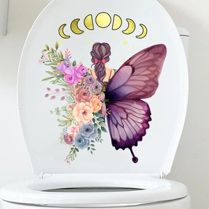 Close-up of butterfly girl and moon floral decal on white toilet cover surface