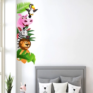 Detail showing colorful cartoon zebra, lion and hippo wall stickers in a child's bedroom
