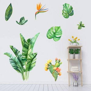 Detail of self-adhesive tropical plant wall stickers featuring hand-painted green monstera leaves