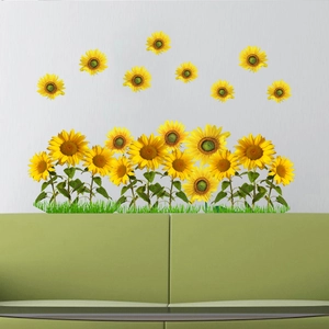 Detailed view of sunflower wall stickers with green leaves on a minimalist home wall
