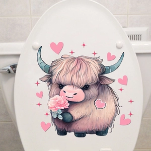 Detail of a cartoon highland cow wall sticker with pink hearts on a white toilet lid