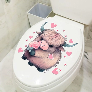 Detail of self-adhesive Highland cow wall sticker with pink hearts in modern bathroom