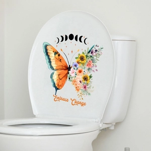 Detail of floral butterfly sticker with Embrace Change text on white toilet lid
