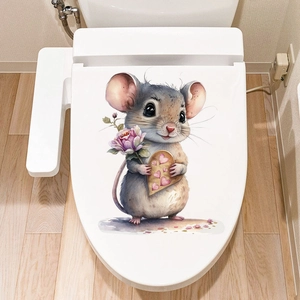 Detail of cute cartoon mouse sticker with heart and flower on a white toilet lid