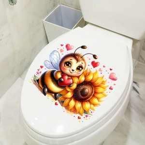 Scene showing cartoon bee and sunflower sticker on a white bathroom toilet lid