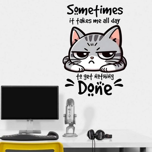 Detail of funny cat wall sticker with humorous quote on a clean white office wall