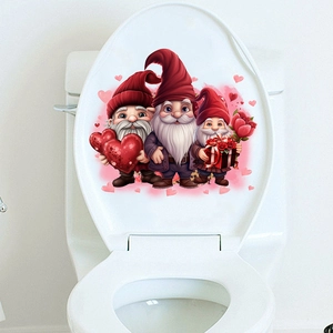 Close-up of Valentine's Day gnome decals with hearts on a white bathroom toilet lid