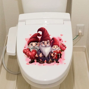 Close-up of cute Valentine gnomes wall stickers applied on a white toilet lid cover