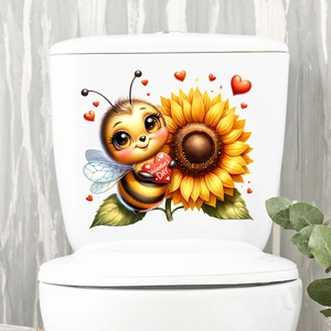 Detail of self-adhesive cartoon bee and heart sticker on a white toilet tank