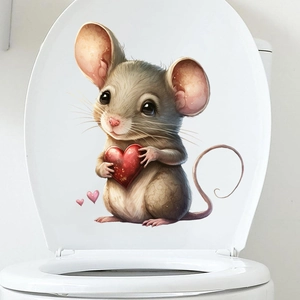 Close-up of a cute cartoon mouse holding a red heart on a white toilet lid cover