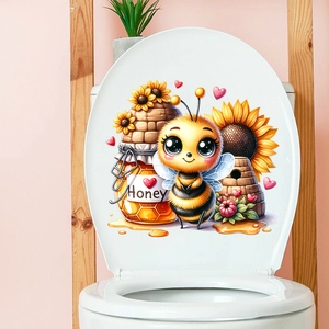 Detailed view of self-adhesive toilet lid sticker with cartoon bee and sunflower motifs