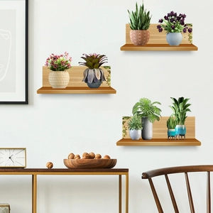 Three-piece wall-mounted wooden shelves set featuring various small artificial green plants