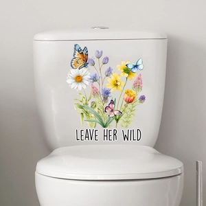 Floral toilet sticker with butterflies and 'LEAVE HER WILD' text on a white tank