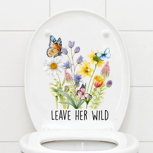 Detail of floral toilet seat sticker with butterfly motifs and Leave Her Wild text
