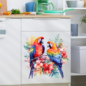 Detail of colorful parrot and tropical flower stickers on white kitchen cabinet