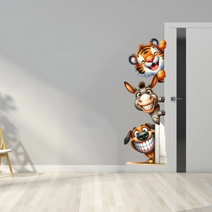 Detailed view of self-adhesive cartoon tiger, donkey and dog wall stickers on a door
