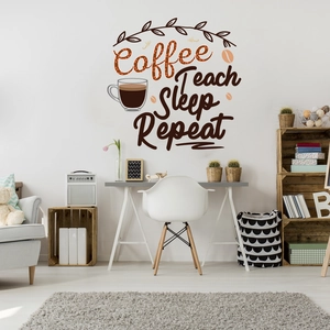 Detail showing 'Coffee Teach Sleep Repeat' wall decal above a minimalist white home desk