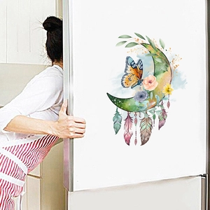Detail of floral moon and butterfly wall sticker applied on a white surface