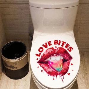 Detail of Love Bites toilet lid sticker featuring red lips and heart lollipop decor
